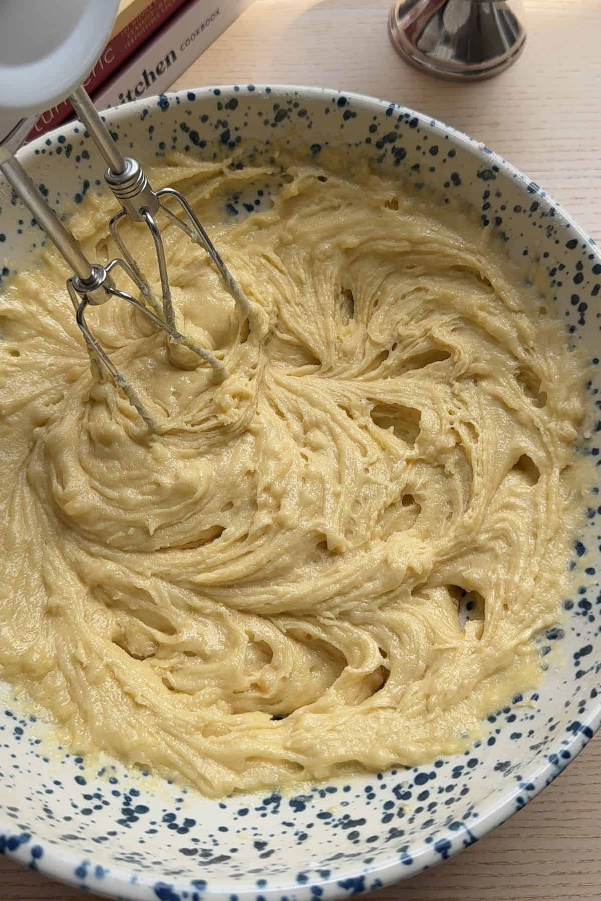 Thick cupcake batter in a mixing bowl.