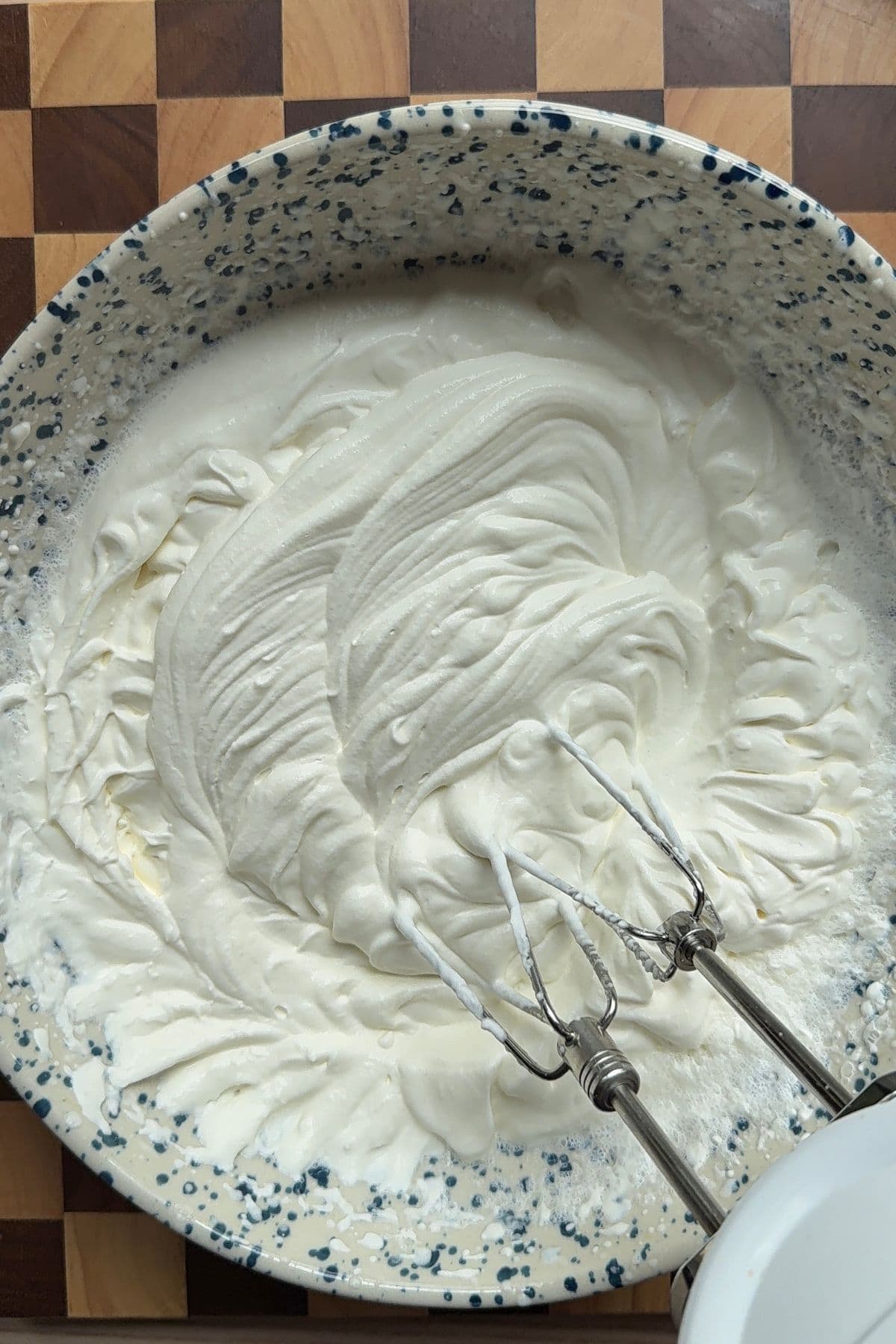 Whipped cream in a large bowl.