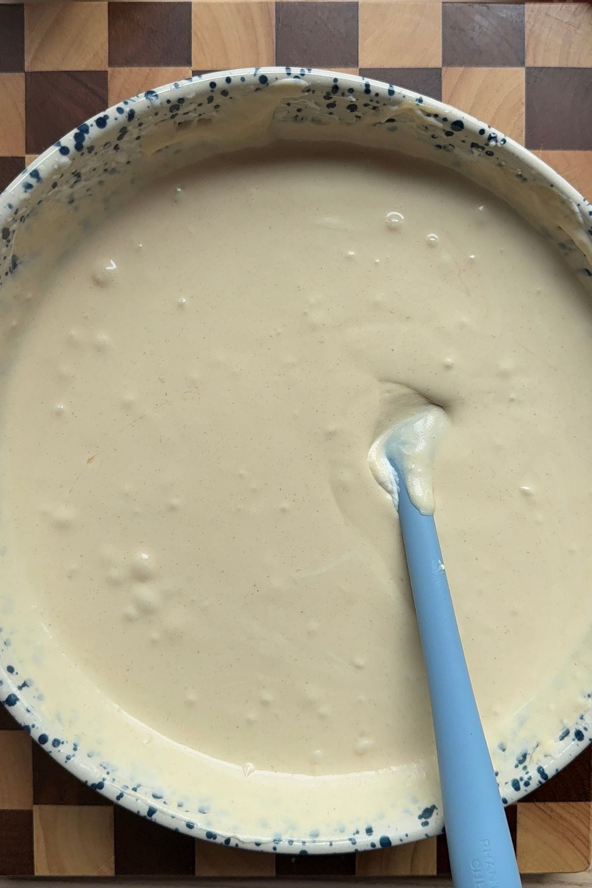 Whipped cream, sweetened condensed milk, and peanut butter combined in a large bowl.