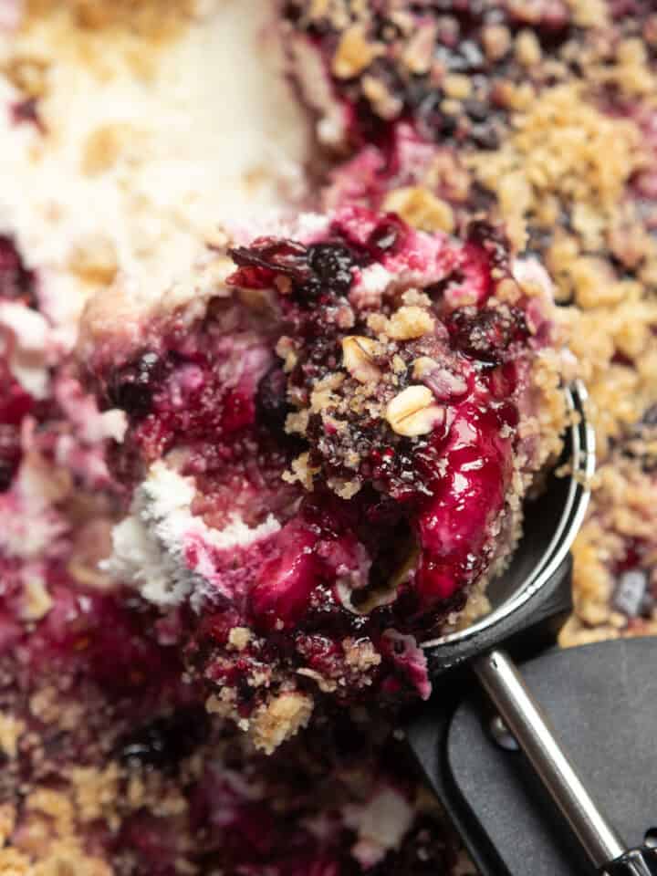 A scoop full of scoopable berry cheesecake.