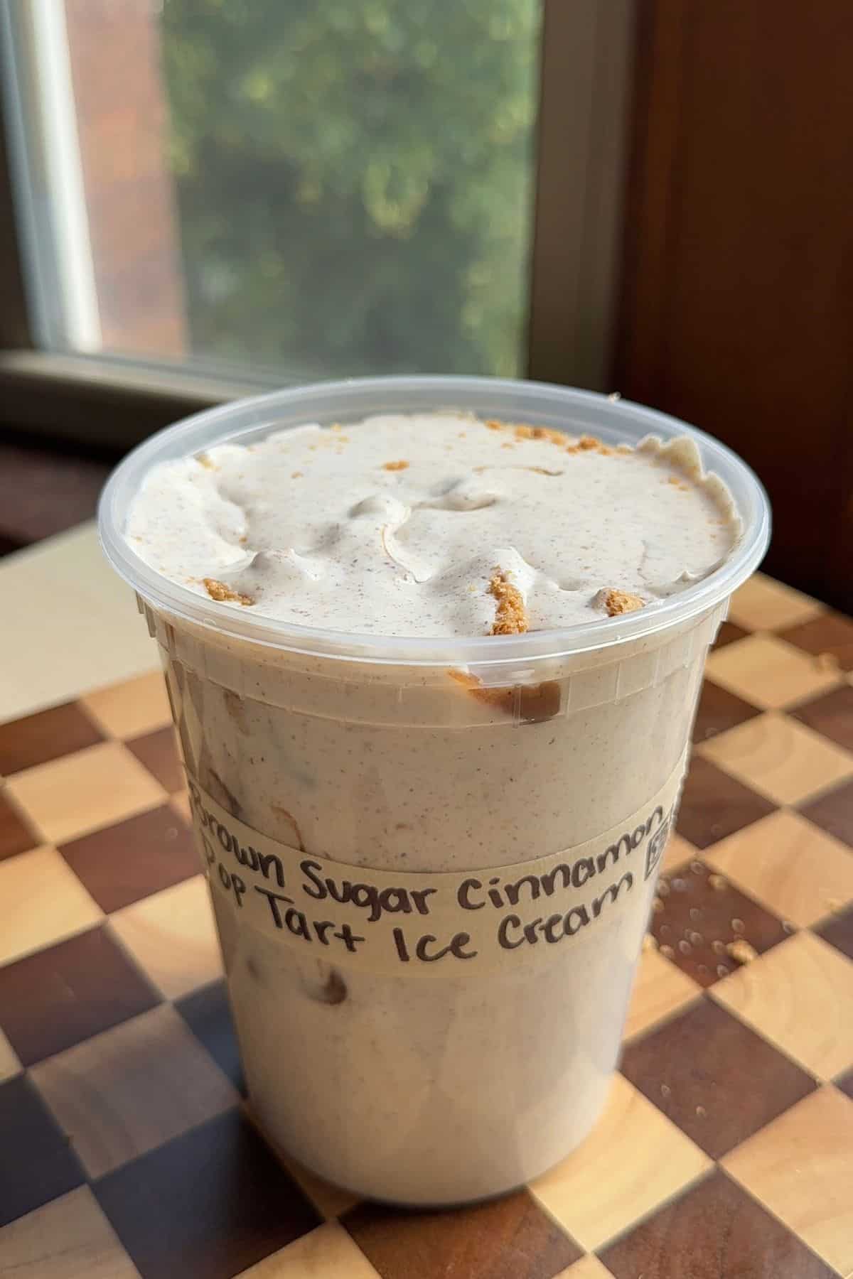 A deli container full of ice cream.
