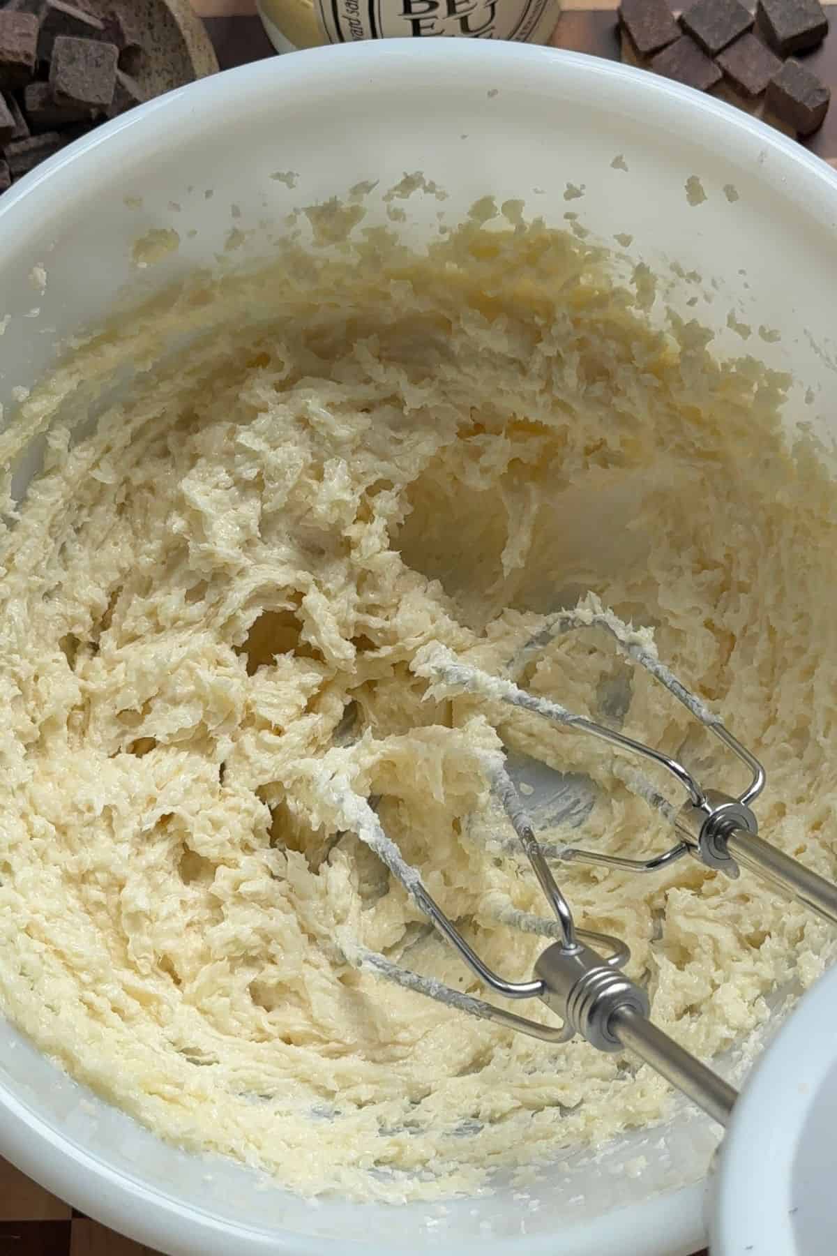 Creamed butter and sugar in a white bowl.