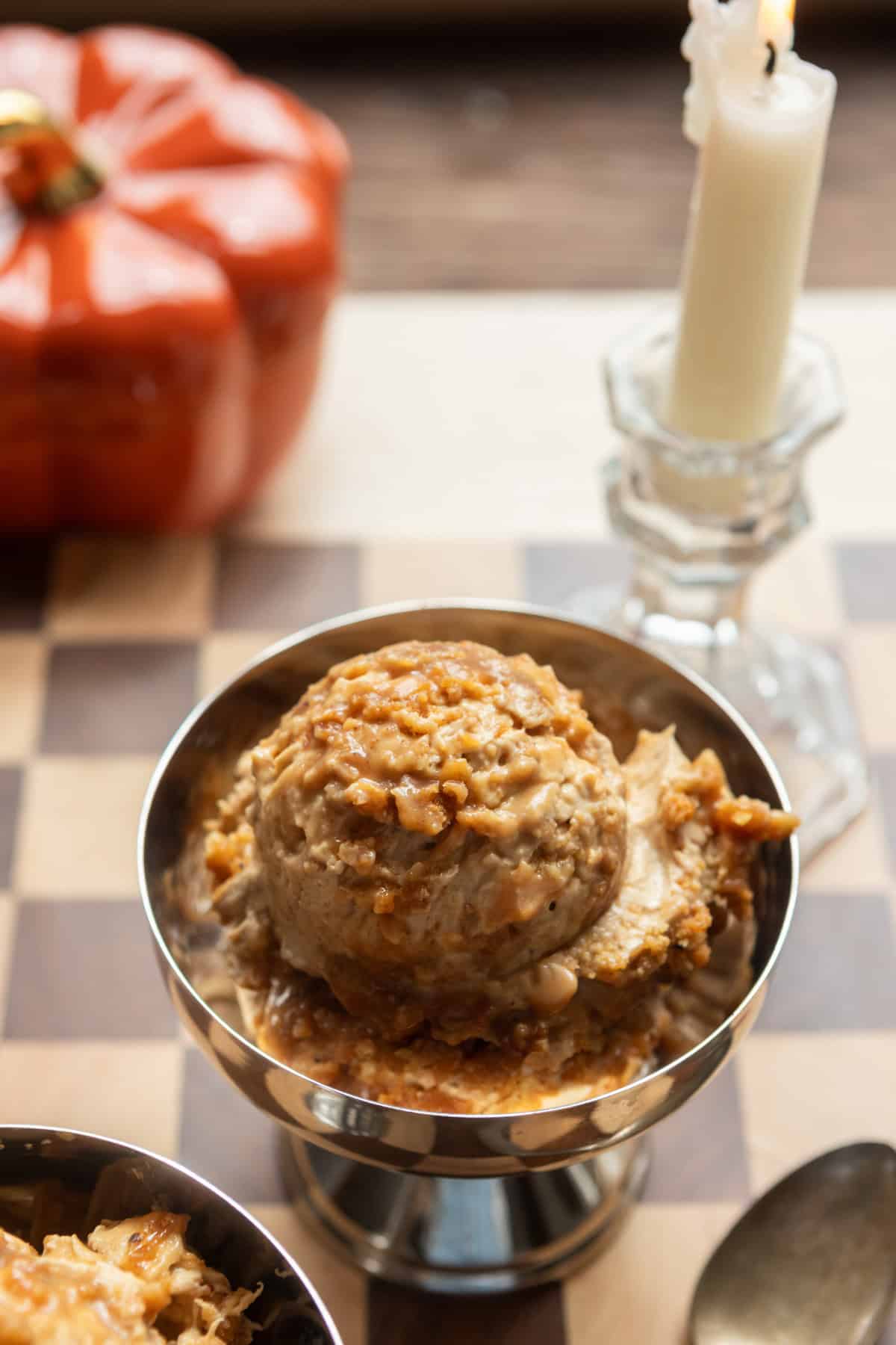 A scoop of dirty chai cheesecake in a metal dish.