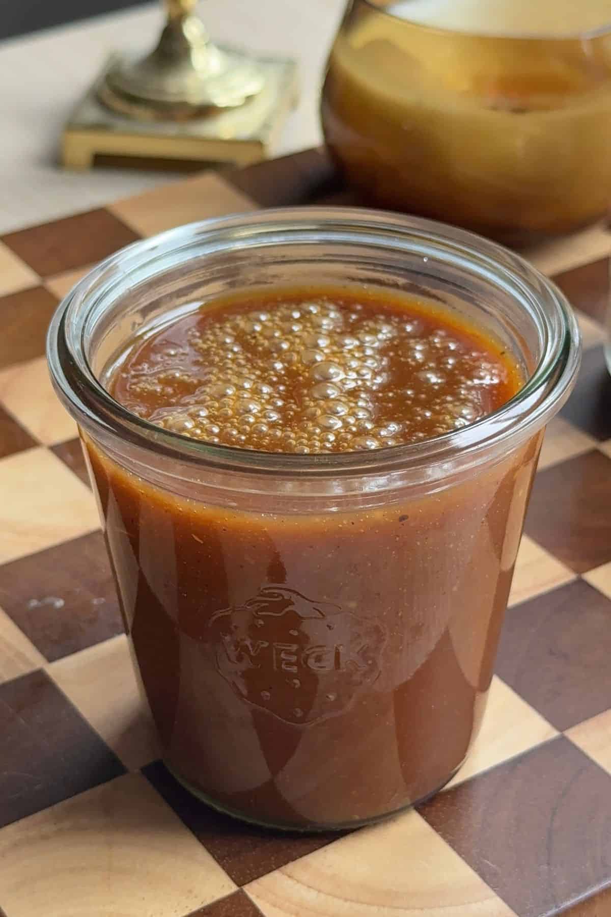 Caramel in a glass jar.