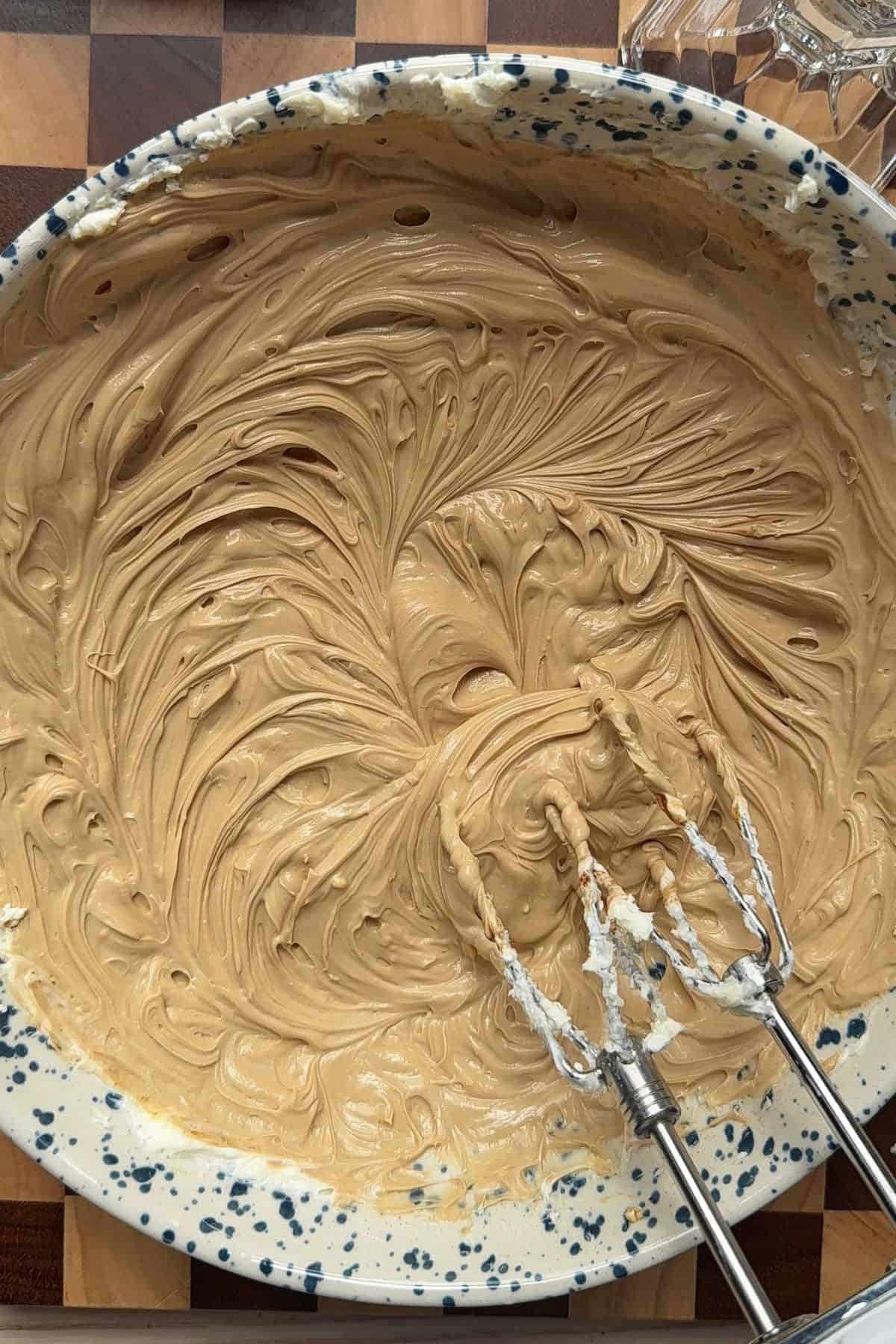 Coffee cheesecake batter in a bowl.