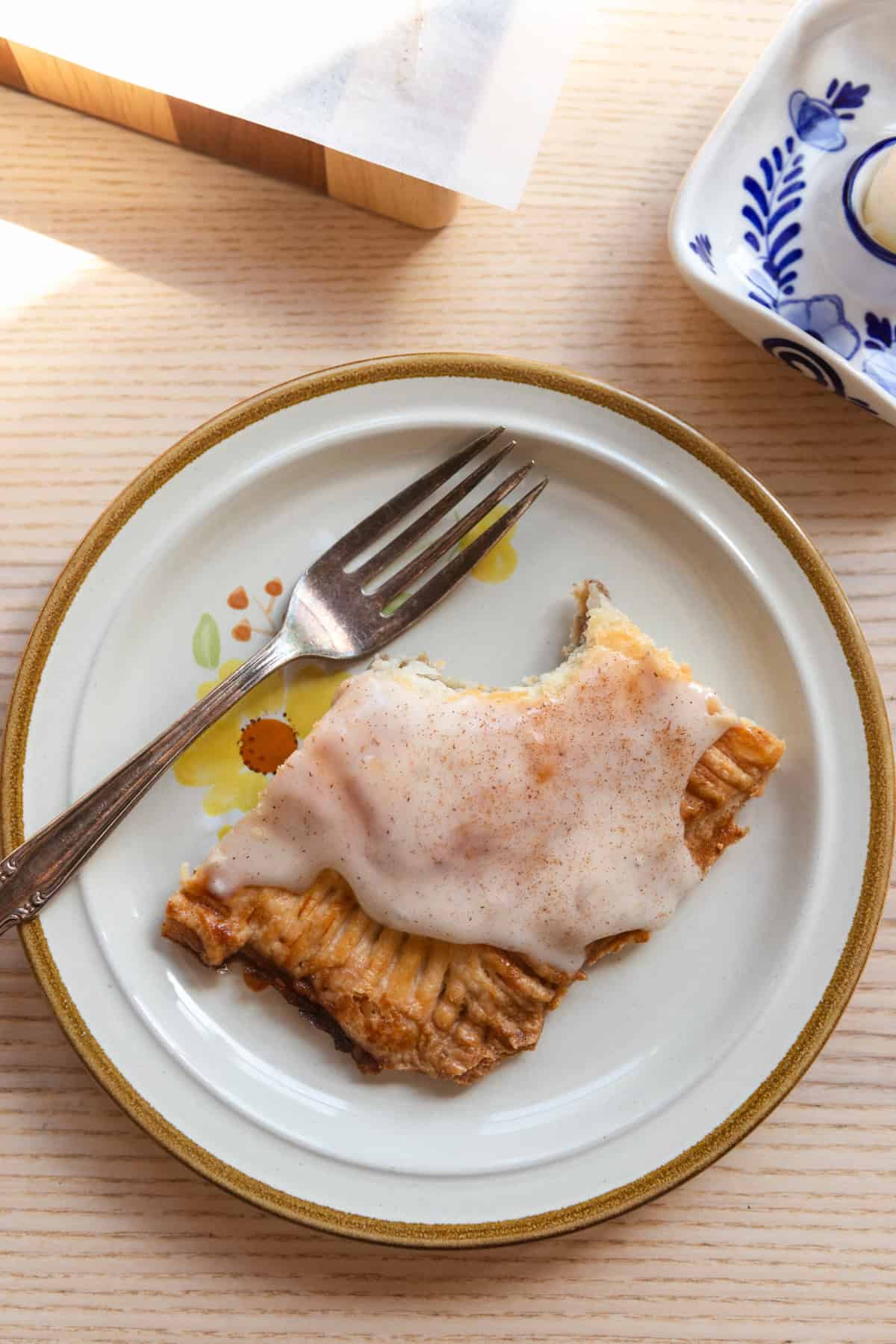 A slice of the giant banana bread pop tart on a plate with a fork.