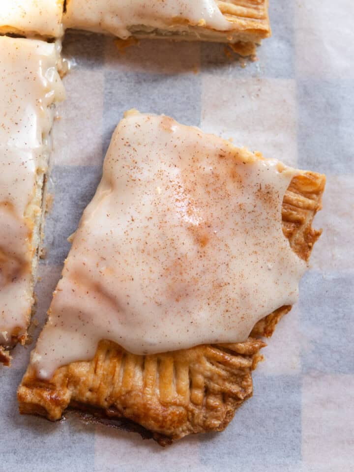 A slice of banana bread pop tart on parchment paper.